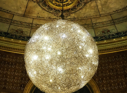 Large vintage-style circular pendant light in feature space