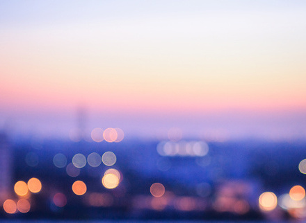 Purple-hued bokeh lighting with a soft, abstract blur